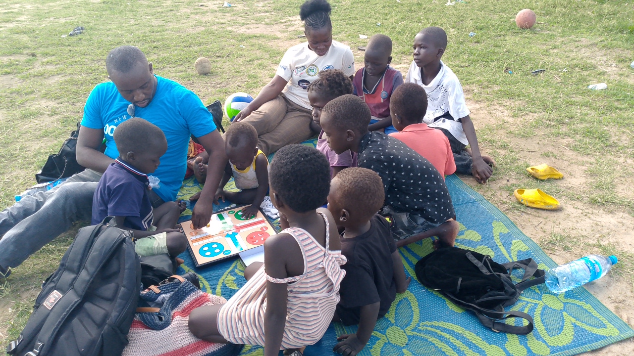 Play with Purpose – Young girls and boys engaged in board games and storytelling, learning social skills and emotional expression.